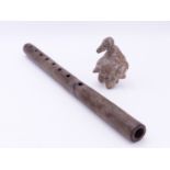 A PRE COLUMBIAN STONEWARE FLUTE TOGETHER WITH A BIRD FORM WHISTLE. (2)