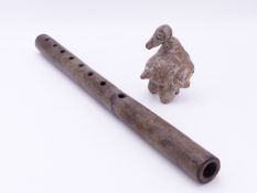 A PRE COLUMBIAN STONEWARE FLUTE TOGETHER WITH A BIRD FORM WHISTLE. (2)