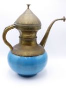 A MIDDLE EASTERN TURQUOISE GLAZED POTTERY AND BRASS KETTLE FORM VESSEL WITH COPPER LINER. 41CM HIGH