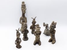 A GROUP OF WEST AFRICAN CAST ALLOY FERTILITY AND OTHER FIGURES. POSSIBLY YORUBA. (7)