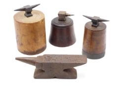 THREE 19TH CENTURY SMALL JEWELLERS ANVILS EACH MOUNTED ON WOODEN BASE TOGETHER WITH A LARGER