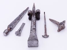 THREE EARLY WROUGHT IRON STONE CHISELS, LARGEST 28 CM LONG TOGETHER WITH TWO SPIKE NAILS . (5)