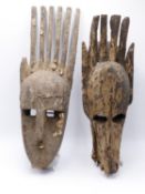 AN AFRICAN TRIBAL MASK WITH COWRIE DECORATION AND ANOTHER JACKAL MASK BAMANA N'TOMO, MALI.