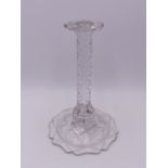 A 19TH CENTURY CUT GLASS WIG STAND ON FACET CUT STEM AND BROAD SHAPED BASE