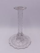 A 19TH CENTURY CUT GLASS WIG STAND ON FACET CUT STEM AND BROAD SHAPED BASE