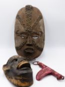 A WEST AFRICAN LARGE WOOD MASK, WITH PAINTED AND IN SHELL INSET DECORATION. ANOTHER MASK WITH