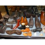 A GROUP OF ANTIQUE AND LATER TREEN AND OTHER SHOE STRETCHERS AND FORMS, COBBLER'S LASTS, ETC ( QTY)