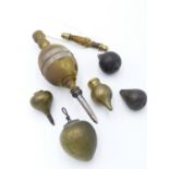 A LARGE BRASS AND STEEL PLUMB BOB WITH CORD AND SPINDLE TOGETHER WITH FIVE FURTHER BRASS, BRONZE AND