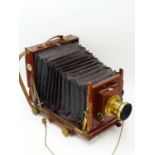 A VICTORIAN THORNTON PICKARD "RUBY" 1/2 PLATE CAMERA, FITTED WITH THORNTON PICKARD MECHANICAL