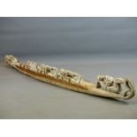 A TRIBAL CARVED WOOD LARGE CANOE WITH OARSMEN 152 CM LONG