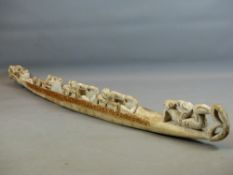 A TRIBAL CARVED WOOD LARGE CANOE WITH OARSMEN 152 CM LONG