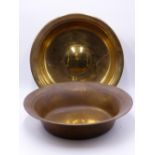 A LARGE RAISED BRASS BOWL WITH CONVEX CENTRE ROUNDEL 37CM DIA AND ANOTHER SIMILAR BOWL. 18TH CENTURY