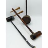 A CHINESE ERHU STRINGED INSTRUMENT OF BAMBOO AND SNAKESKIN CONSTRUCTION, ANOTHER SIMILAR AND A THIRD