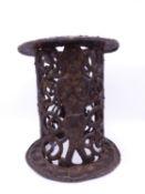 A RARE AND FINELY CAST BRONZE STAND WITH PANELS OF MALE AND FEMALE TRIBES PEOPLE SURROUNDED WITH