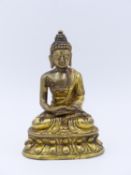 A FINE 19TH CENTURY TIBETAN GILT BRONZE BUDDHA SEATED ON LOTUS FORM BASE 10.5CM HIGH