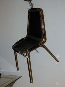 A SET OF FOUR RETRO CHROME AND LEATHER CHAIRS