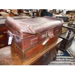 AN UNUSUAL AND RARE ANTIQUE BRASS BOUND LEATHER EXPANDING TRAVELLING TRUNK. WITH BRASS LABEL W.