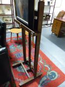 AN ANTIQUE OAK STUDIO EASEL