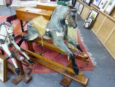 A VINTAGE ROCKING HORSE ON TRESTLE BASE