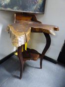 A BURRWOOD NATURAL FORM CORNER TABLE