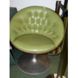 A PAIR OF LEATHER UPHOLSTERED TUB FORM EGG SWIVEL CHAIRS
