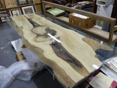 A VERY LARGE BESPOKE MADE COFFEE TABLE WITH NATURAL FORM PLANK TOP AND TRESTLE BASE