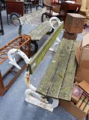 TWO VICTORIAN AND LATER CAST IRON GARDEN BENCHES, EACH WITH PLANK SEATS AND BACKS SUPPORTED BY
