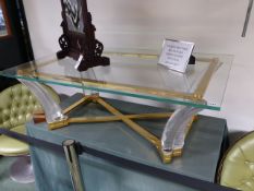 A RARE BACCARAT CUT GLASS COFFEE TABLE ON SWEPT SUPPORTS WITH GILT MOUNTS.