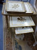 A NEST OF THREE ITALIANTE LYRE BASE TABLES. GILT AND PAINTED DECORATION, WITH TRAY TOPS