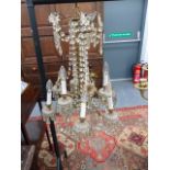 A VINTAGE FRENCH STYLE GILT BRASS FRAME NINE LIGHT CHANDELIER, FLOWER HEADS WITH SWAGS AND PRISMS