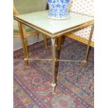 A PAIR OF GILT BRASS GLASS TOP LAMP TABLES. REEDED LEGS WITH CROSS STRETCHERS. 50CM SQUARE