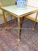 A PAIR OF GILT BRASS GLASS TOP LAMP TABLES. REEDED LEGS WITH CROSS STRETCHERS. 50CM SQUARE