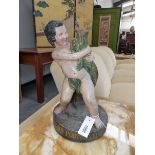 A 19TH CENTURY POLYCHROMED TERRA COTTA FIGURAL GROUP OF A BOY HOLDING A DOLPHIN. INSCRIBED HENRY