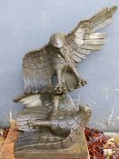 A LARGE CARVED STONE GARDEN SCULPTURE OF TWO SPREAD WING EAGLES