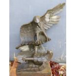 A LARGE CARVED STONE GARDEN SCULPTURE OF TWO SPREAD WING EAGLES