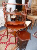 AN EDWARDIAN INLAID SHAPED OVAL TWO TIER TABLE. A THREE TIER HANGING SHELF AND A ARTS AND CRAFTS