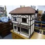 AN ANTIQUE DOLL'S HOUSE WITH FURNISHINGS. 91cms WIDE.