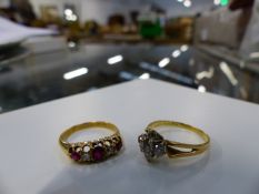 A FIVE STONE DIAMOND DRESS RING AND A RUBY AND DIAMOND FIVE STONE RING SET IN 18ct GOLD. (2)