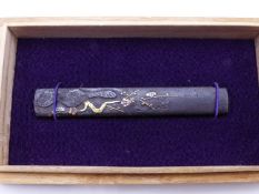 A KOZUKA HANDLE, THE IRON BODY DECORATED WITH CHERRY BLOSSOMS AND HIGHLIGHTED IN COPPER, SILVER