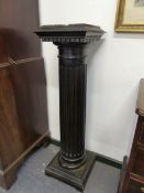 A PAIR OF EBONISED DISPLAY PLINTHS WITH MARBLE TOPS. 113cms HIGH