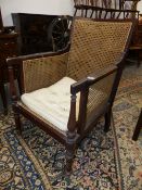 A 19TH.C.MAHOGANY BERGERE LIBRARY CHAIR