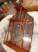 A VICTORIAN MIRROR BACK WALL SHELF. APPROX 78cms HIGH.