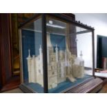 AN ANTIQUE GLAZED CASED DIORAMA OF AN IMPRESSIVE CONTINENTAL CHATEAU, THE CASE 66cms WIDE