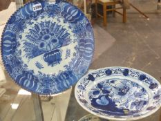 A DELFT BLUE AND WHITE POTTERY CHARGER WITH FRILLED RIM 35CM DIAMETER TOGETHER WITH ANOTHER, 30CM