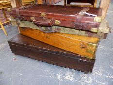 TWO OAK AND BRASS GUN CASES, A DOUBLE LEATHER GUN CASE AND ONE OTHER