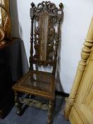 AN ANTIQUE OAK HIGH BACK CHAIR.