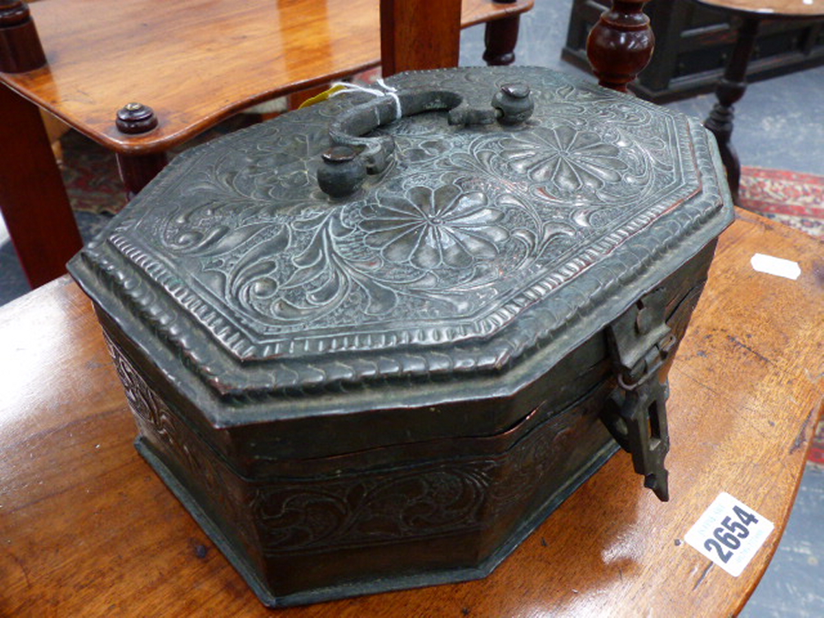 AN INDIAN SILVERED REPOUSSE COPPER OCTAGONAL FITTED LIFT TOP CONDIMENT CASE