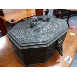 AN INDIAN SILVERED REPOUSSE COPPER OCTAGONAL FITTED LIFT TOP CONDIMENT CASE