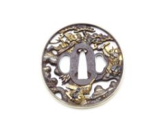 **A VERY FINE LATE EDO PERIOD MOGANASHI NYUHDO PIERCED TSUBA, DECORATED WITH THREE SAMURAI AMIDST