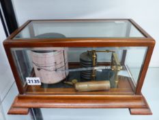 AN OAK CASED GLAZED RECORDING BAROGRAPH.